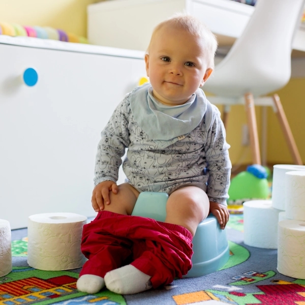 Young baby sitting on a potty