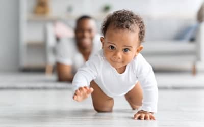 A baby crawling, possibly towards a potty