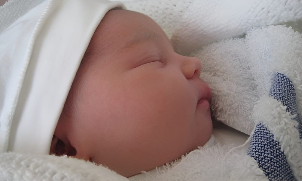 A newborn baby sleeping peacefully