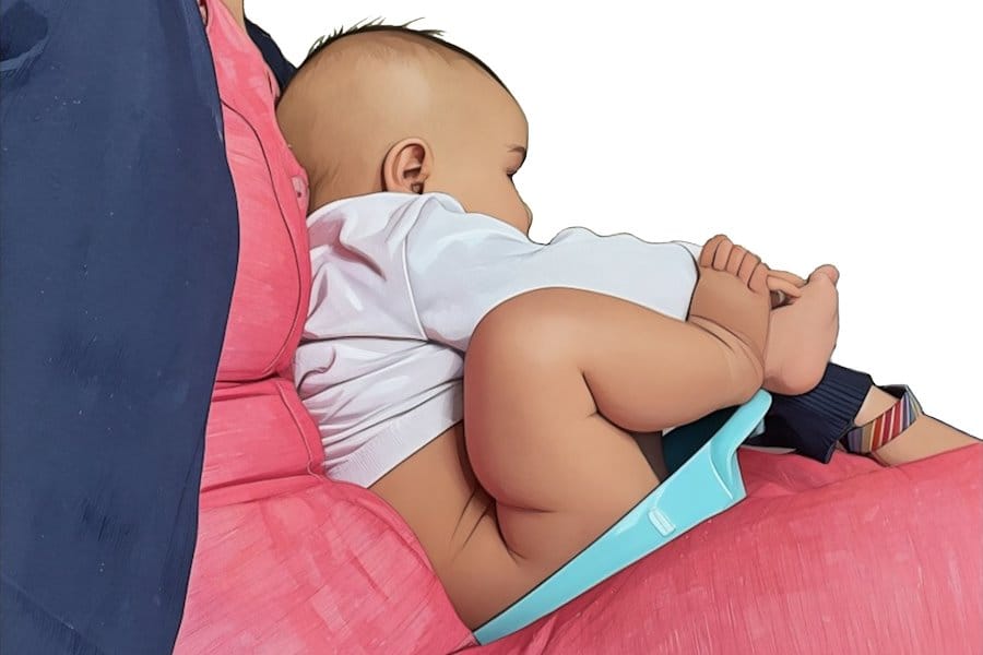 A mother using a tophat potty to do elimination communication with her newborn baby